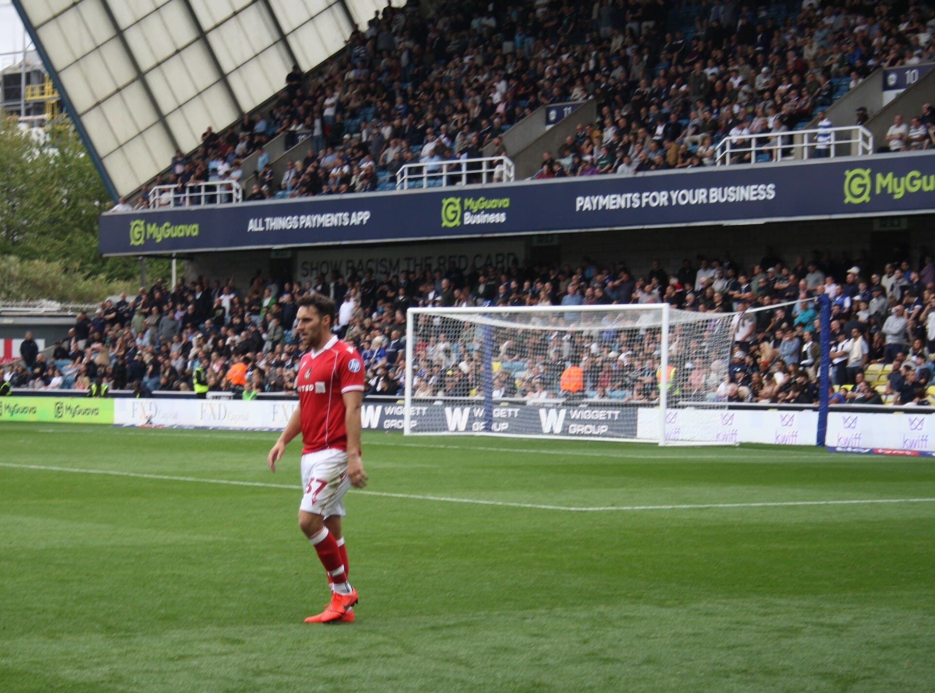Wrexham players in red during the match at Millwall, August 2025